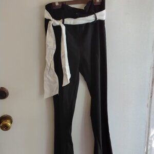 Two pairs of pants,  one black,  one white, same style,  size 7
